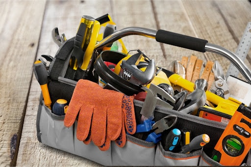 Set of tools and instruments in box isolated on background.