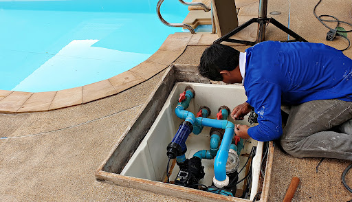 Plumber fixing pool plumbing.